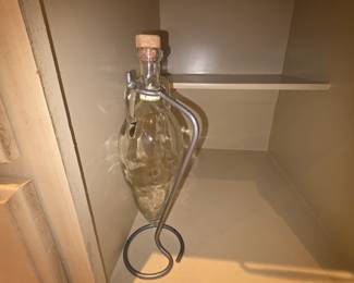 Decorative bottle in holder