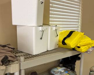 Garage ice chests, life vests