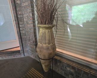 Large urn in metal holder