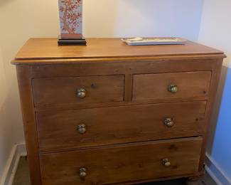 Lovely pine dresser with brass knobs.