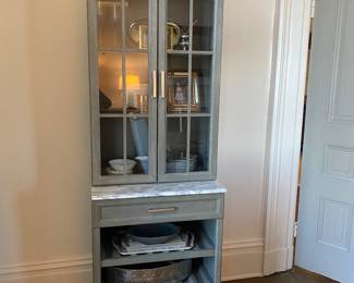 Front Gate cabinet set with two hutches and one center cabinet. One hutch has glass doors over shelving (with wine rack) and other hutch has wooden doors over lower cabinet with drawers.