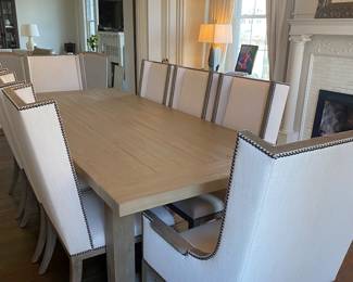 Large RH dining table with additional leafs. Six fabric side chairs and two matching end chairs.