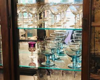 Assorted stemware - martini glasses, pale blue wine glasses & more
