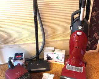 Miele vacuums: 2006 “Red Velvet” canister, “Salsa” upright (both include box of bags)