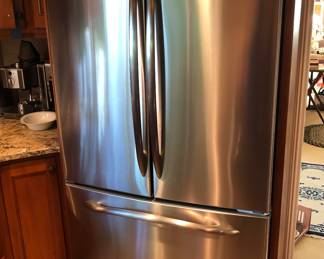 2012 GE Profile stainless refrigerator - 20.7 cu.ft. counter depth French door style, Model PFCS1NFSZ (70"H, 36"W, 31"D)