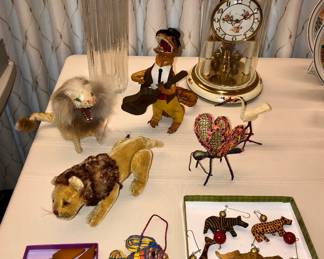 Vintage mohair lion with movable legs, German lion wind-up toy, Cuban stuffed alligator musician, Bakelite corn holders, African animal ornaments, Kern dome clock
