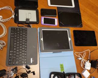 Mystery Lot Of Tablets , iPhone, Ear Buds, And Power Cables