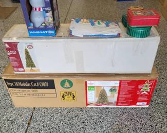 Artificial Christmas Trees, Animated Snowman, Christmas Tins And Tablecloth
