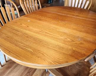 Round Paw Foot Table with two leafs (shown here) and 6 Matching Chairs.