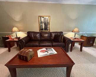 Brown leather couch by Ashley