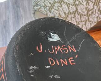 Signature on base of vase