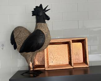 3 copper serving trays and a rooster