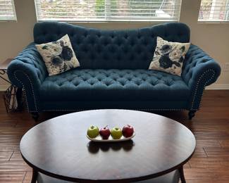Coffee table, blue tufted couch
