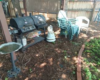 Yard decor, chairs and grill