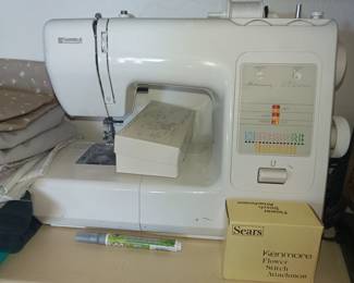Kenmore sewing machine with accessories