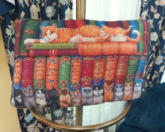3 of my favorite things all in one. Cats, books, and a pillow