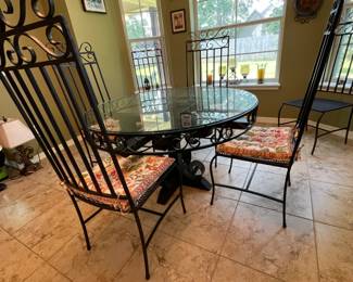 Custom-made wrought iron dining set. Glass top, 6 chairs.