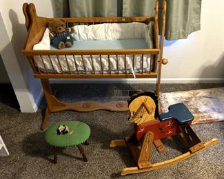 Handcrafted cradle and rocking horse made with love in the mid 90's by Grandpa for the now 31 and 29 year old kids. Stool with panda by Aunt Martha.