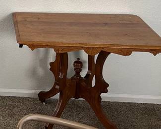 Antique Victorian side table - two types of wood,carved, porcelain wheels (Late 1800s)