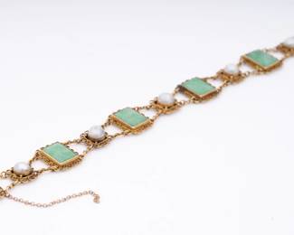 https://www.liveauctioneers.com/item/207340884_14k-gold-emerald-and-pearl-bracelet