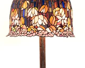 https://www.liveauctioneers.com/item/207340970_tiffany-style-bellflower-leaded-glass-table-lamp-with-tree-trunk-base