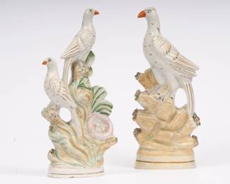 https://www.liveauctioneers.com/item/207340843_pair-of-early-english-pottery-bird-figures-nesting-doves-and-rock-perch