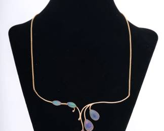 https://www.liveauctioneers.com/item/207340879_modernist-10k-gold-opal-necklace