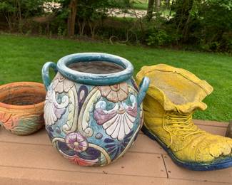 many planters and pots of all shapes and sizes