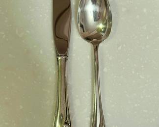 Close up - Unopened Sterling Gorham - 2 knives, 2 lg. forks, 2 sm. forks, 2 soup spoons, butter knife, sugar spoon, cheese knife