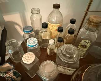 Glass medicine bottles, baby bottles, and assorted array of glass