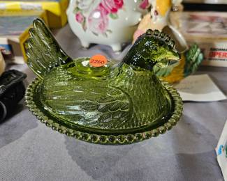 GREEN HEN ON NEST
