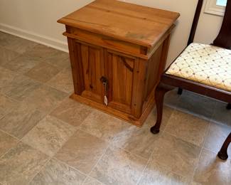 This is made from reclaimed old heart pine. What is so cool is it has a hidden drawer right under the top.