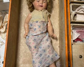 Early Shirley Temple doll with a trunk full of clothes.
