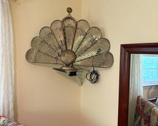 Brass fireplace screen sitting on a TV wall mount. I wanted it to be seen.