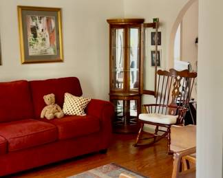 Living room. Glass curved front curio display cabinet