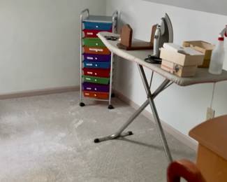 Ironing board. Iron. Storage vertical.