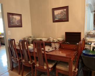 Redwood Dining Table and Chairs. It come with 2 leaves has sold
