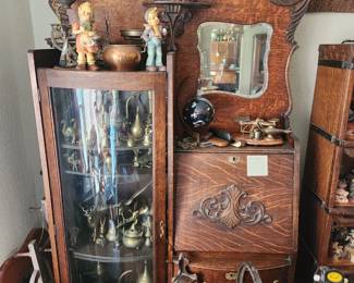 Antique oak secretary with curved glass door