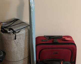 Clean travel luggage, remnant carpet, curtain rod and binoculars