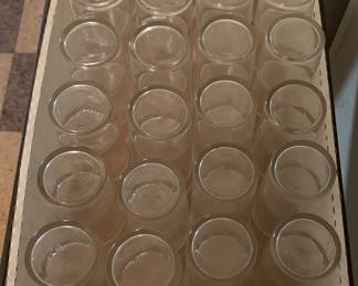 64 glasses ready for a party or function.