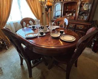 Paul Bunyan dining table and china cabinet.