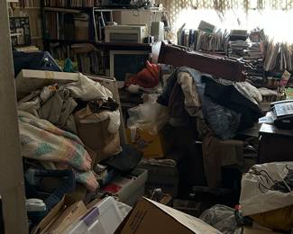 The office before and after Heritage staging. Books, cameras, electronics, filing cabinets and more.