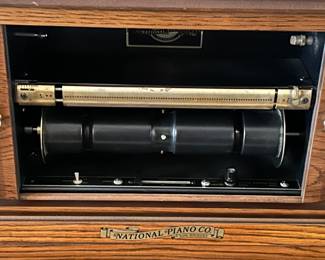National Piano Co. player piano with over 100 player rolls.
