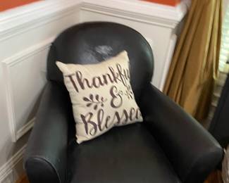 Black leather corner chair and ottoman