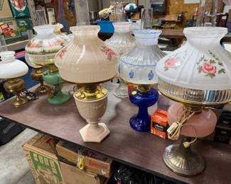 Aladdin oil lamps. Some Uranium / vaseline glass. Link: https://modestlambestatesales.hibid.com/