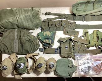 LARGE MISC. US MILITARY SURPLUS LARGE MISC. US MILITARY SURPLUS (4) CANTEENS, DUFFLE BAGS, BANDOLEERS, AMMO POUCHES, DUTY BELTS, MOSQUITO NET. COOKING KIT.