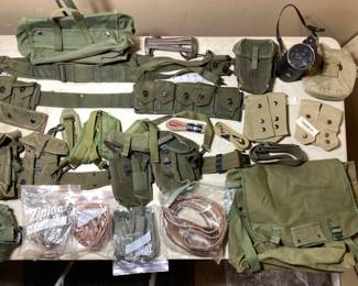 LARGE MISC. US MILITARY SURPLUS LARGE MISC. US MILITARY SURPLUS (4) CANTEENS, DUFFLE BAGS, BANDOLEERS, AMMO POUCHES, DUTY BELTS, MOSQUITO NET. COOKING KIT.