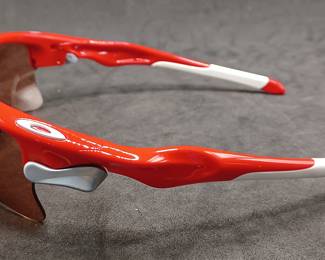 pristine OAKLEY red and white sunglasses, hard to find, comes with case, like new.