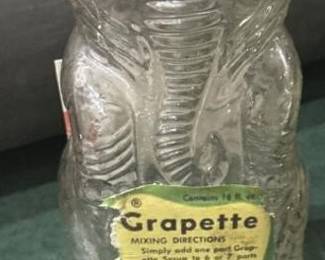 Grapette elephant bottle with old Bennington brown clay marbles
