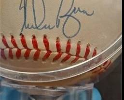 Nolan Ryan autographed baseball on stand